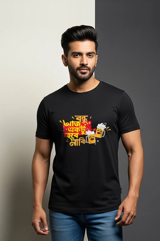Man wearing a black t-shirt with colorful graphics and text on a gray background