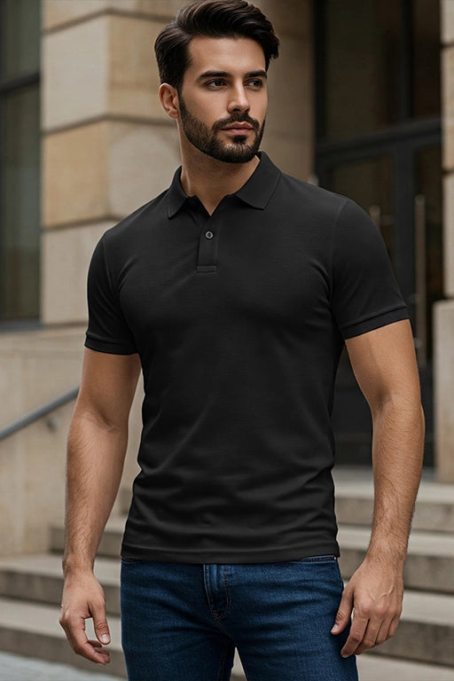 Black KRAZYKIND polo shirt displayed flat, showcasing the classic collar and short sleeves on a neutral background.