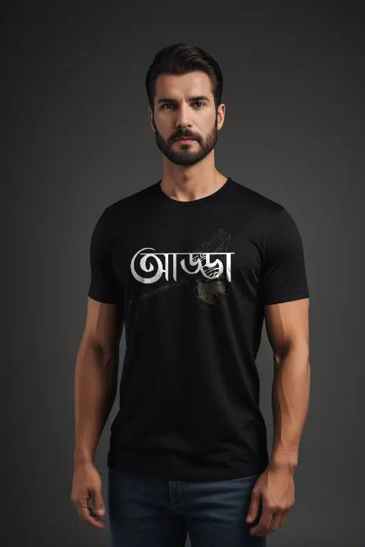 Man wearing a black t-shirt with white text on a dark background