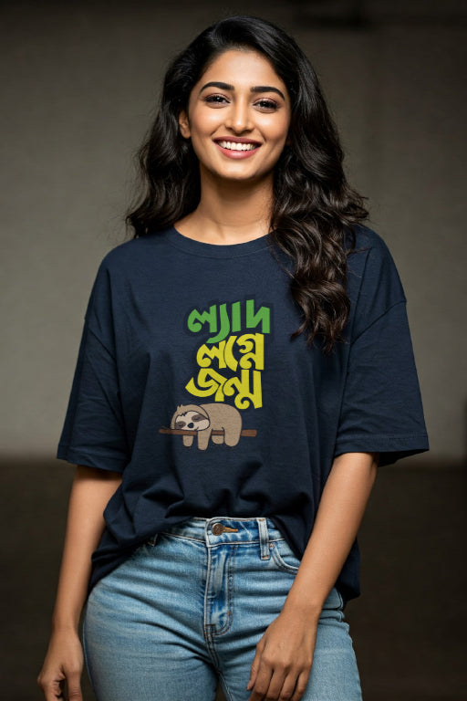 Woman wearing a navy blue t-shirt with green and yellow text and a bear graphic.