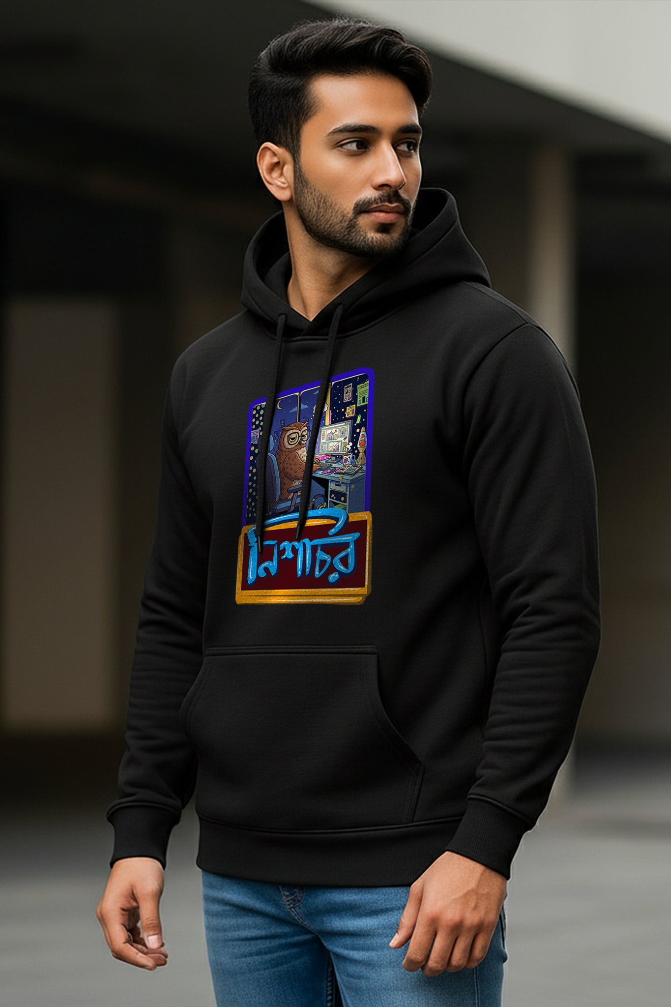 Man wearing a black Nishachor Hoodie by KRAZYKIND, shown in a side profile view.