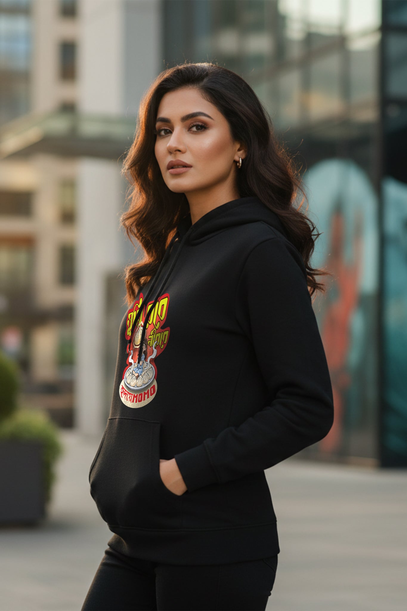 Black Momo hoodie by KRAZYKIND worn by woman, side view showing front and side details of the casual sweatshirt.