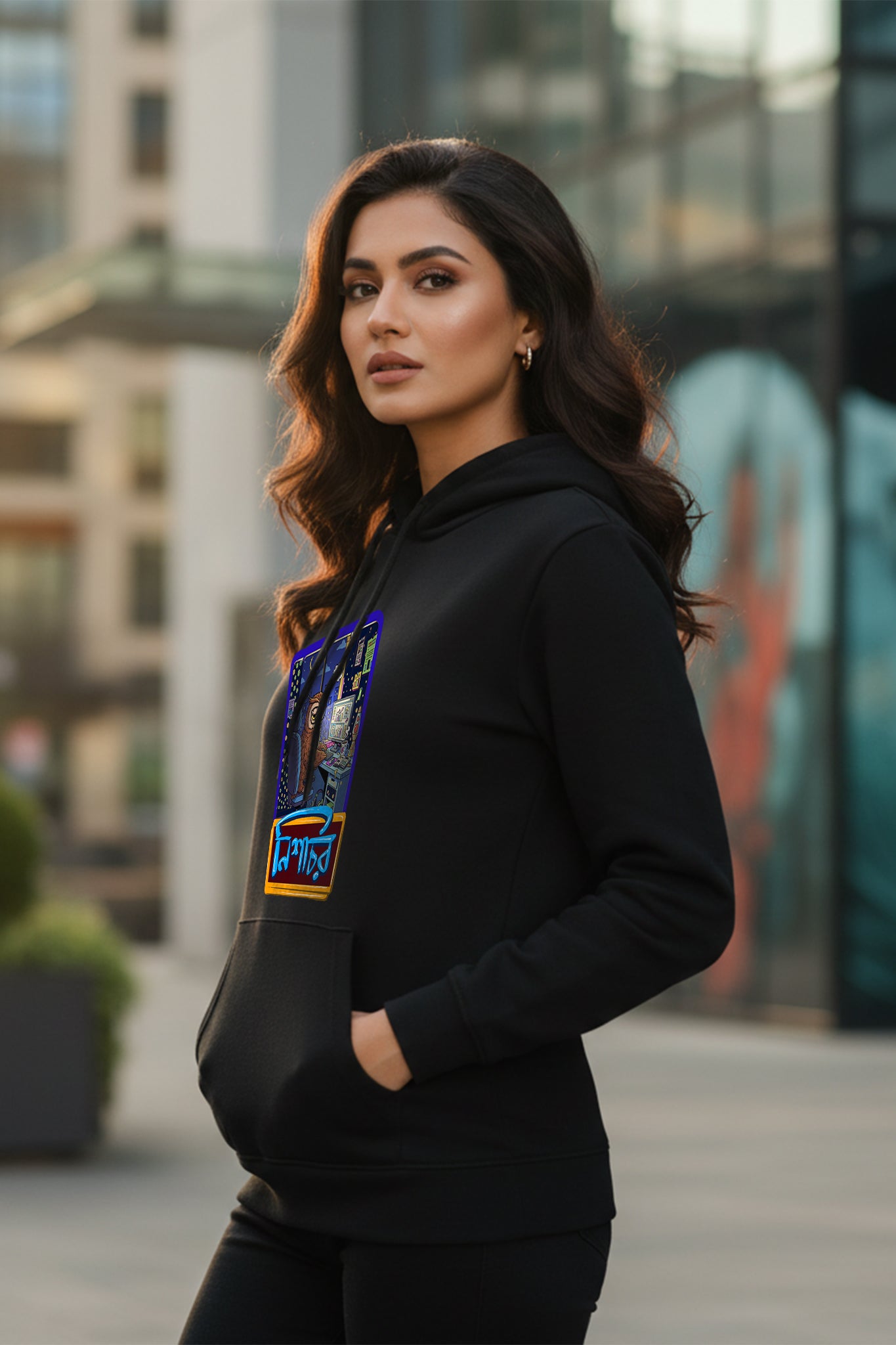 Side view of a woman wearing the Nishachor Hoodie by KRAZYKIND, showcasing the relaxed fit and stylish design.