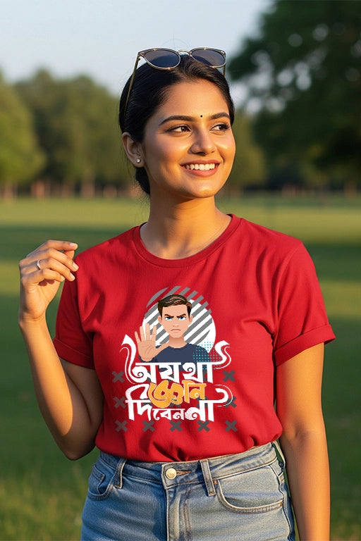 Woman wearing a red t-shirt with a graphic design outdoors