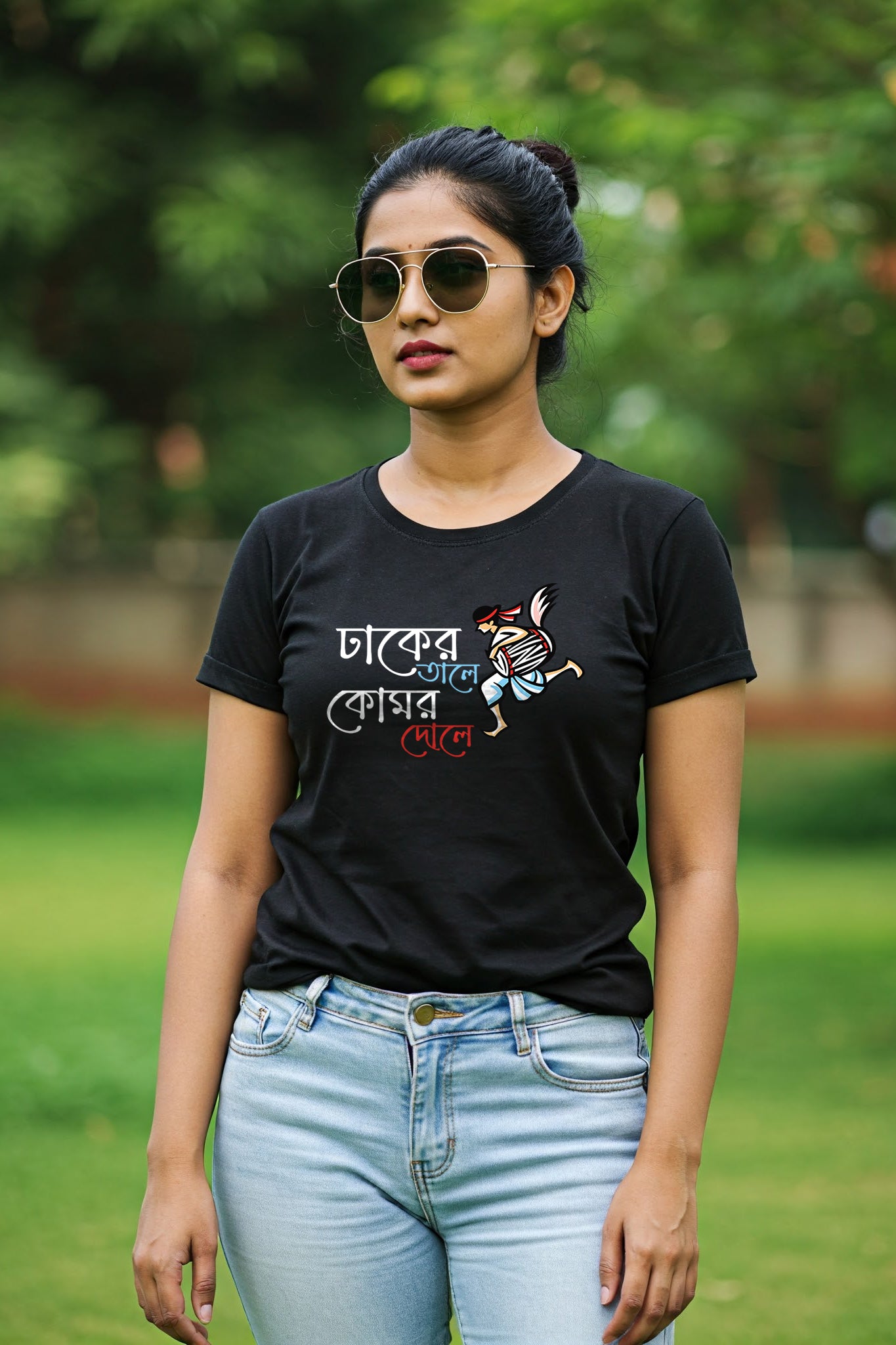 Woman wearing a black Dhak Ar Tale by KRAZYKIND, traditional Indian head jewelry with intricate design.