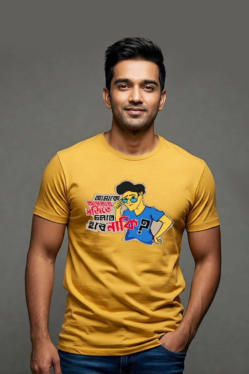 Man wearing a yellow t-shirt with a graphic design on a gray background