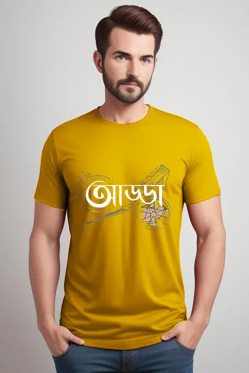 Man wearing a mustard yellow t-shirt with text and graphics on a plain background