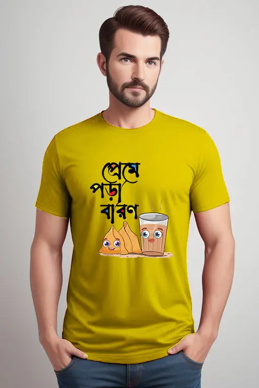 Man wearing a yellow t-shirt with cartoon graphics and text on a plain background